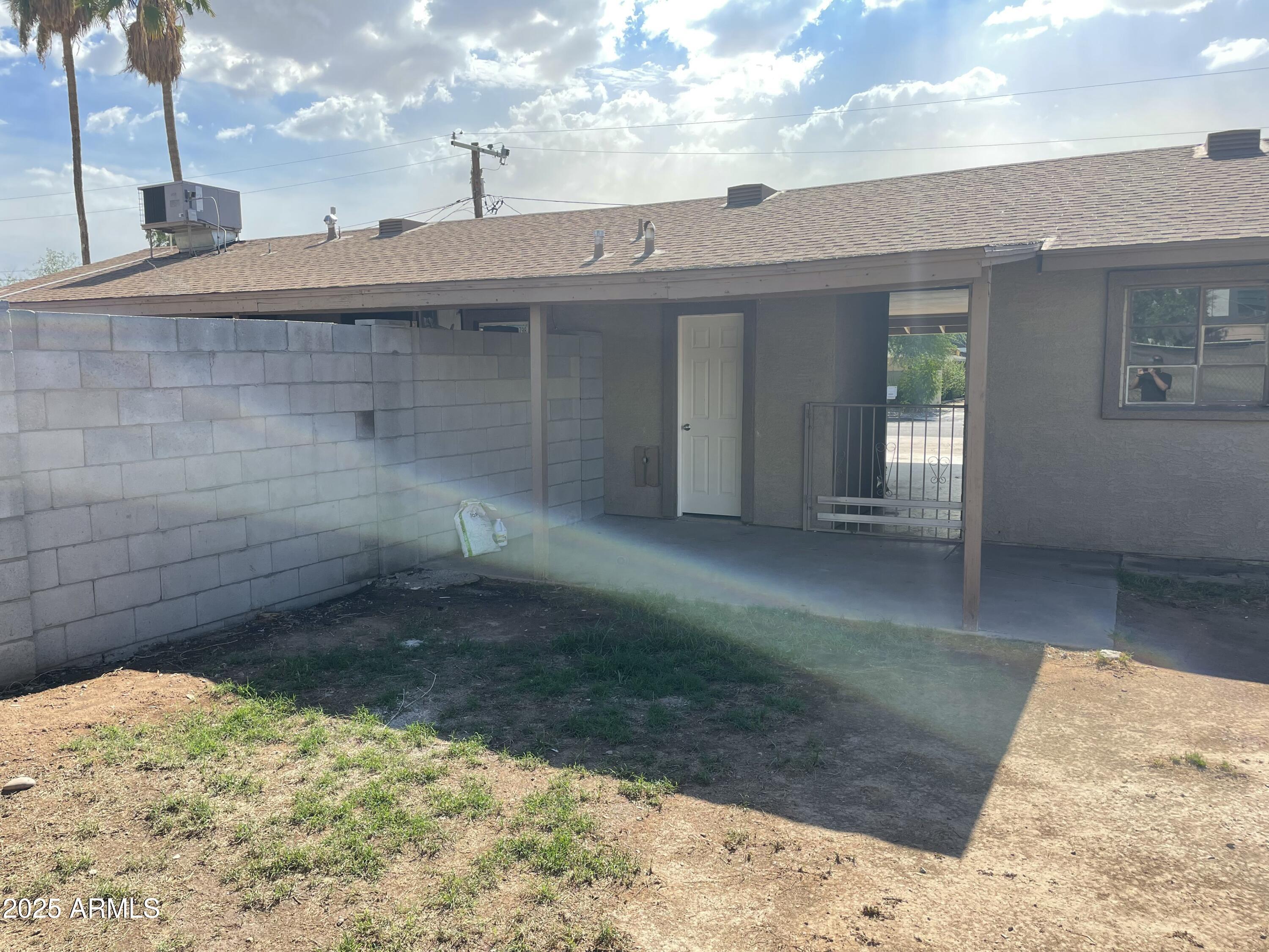 2811 North 17th Place Phoenix, AZ 85006 - Photo 25 of 28 a view of a house with a backyard