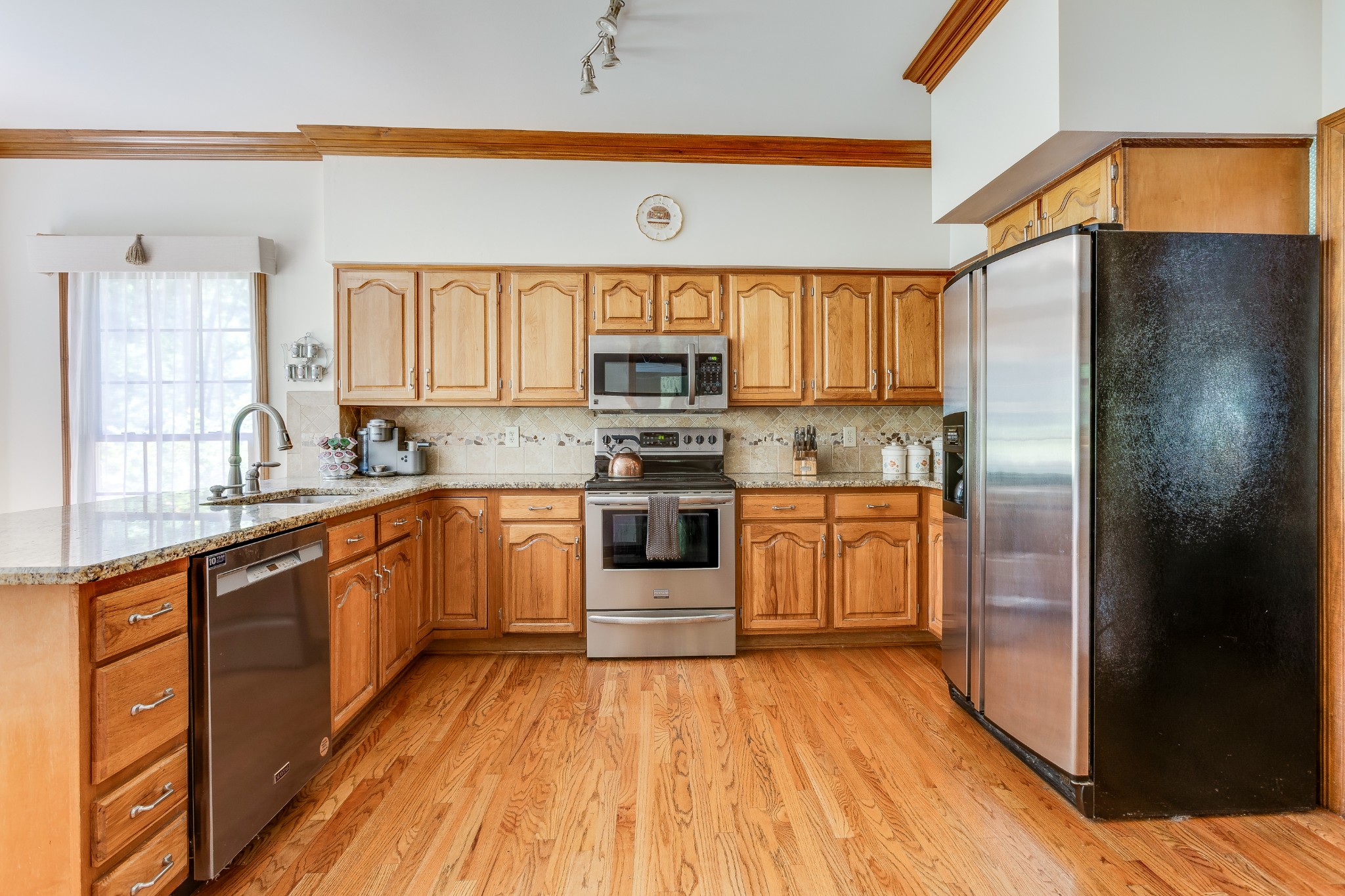 1111 Temple Ridge Court Nashville, TN 37221 - Photo 15 of 46 a kitchen with stainless steel appliances a refrigerator sink and stove