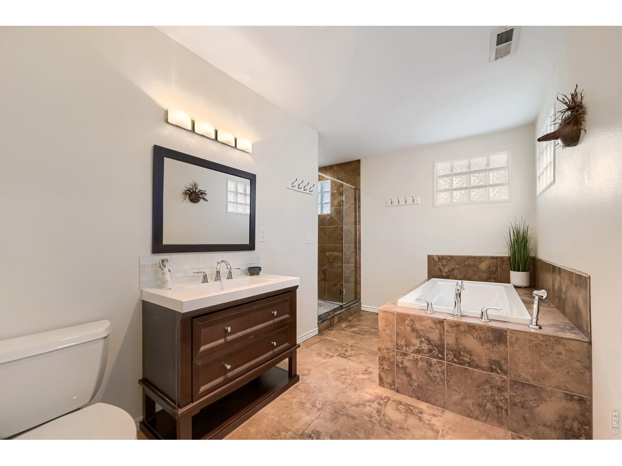 245 High Street Lyons, CO 80540 - Photo 13 of 49 5-piece luxury primary bath with walk-in shower