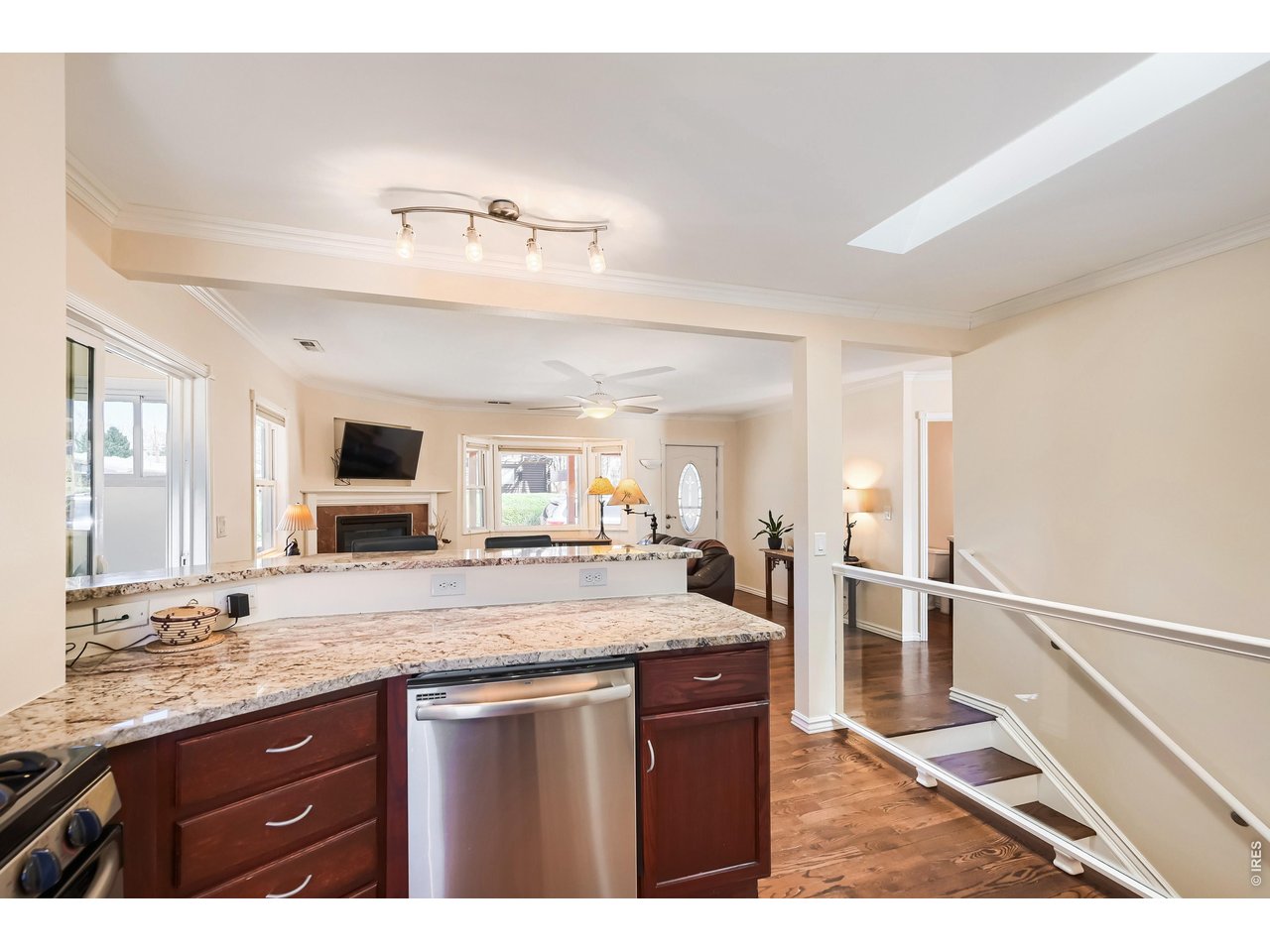 245 High Street Lyons, CO 80540 - Photo 9 of 49 Open living, dining and kitchen space with hardwood floors on main level