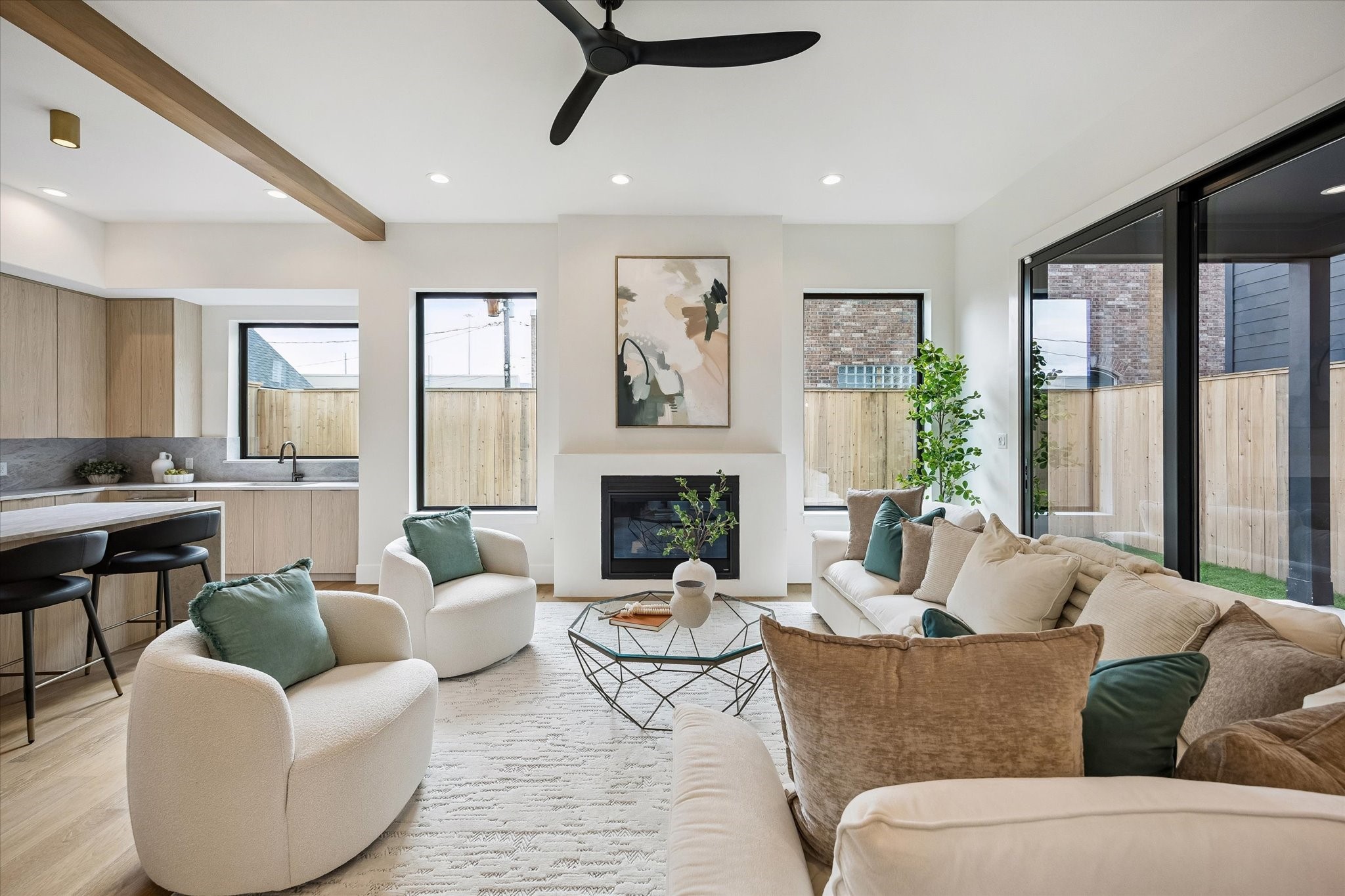 335 Harvard Street Houston, TX 77007 - Photo 2 of 35 Living room – features a gas fireplace and ample windows that fill the space with natural light.