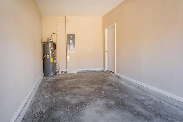 a view of a house with wooden fence