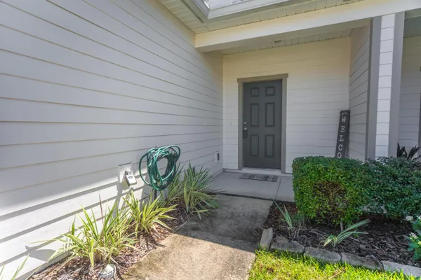 a view of a chairs and table in a backyard
