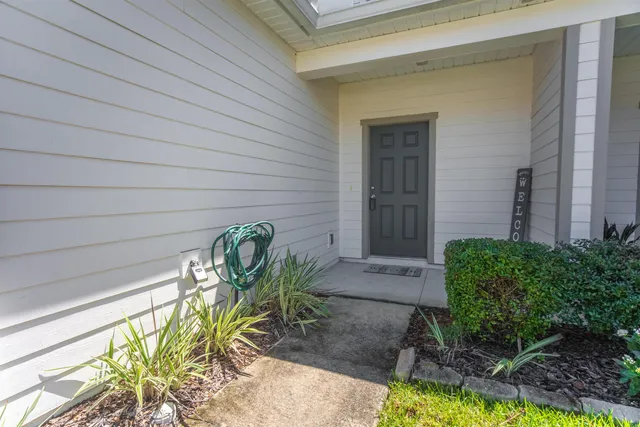 a view of a chairs and table in a backyard