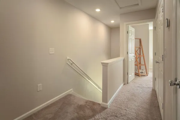 a bed room with a bed and a chair