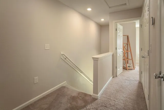 a bed room with a bed and a chair