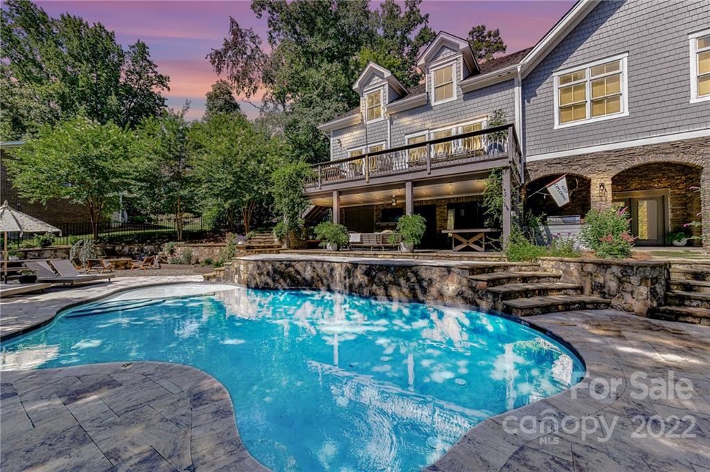 a view of a swimming pool with sitting area