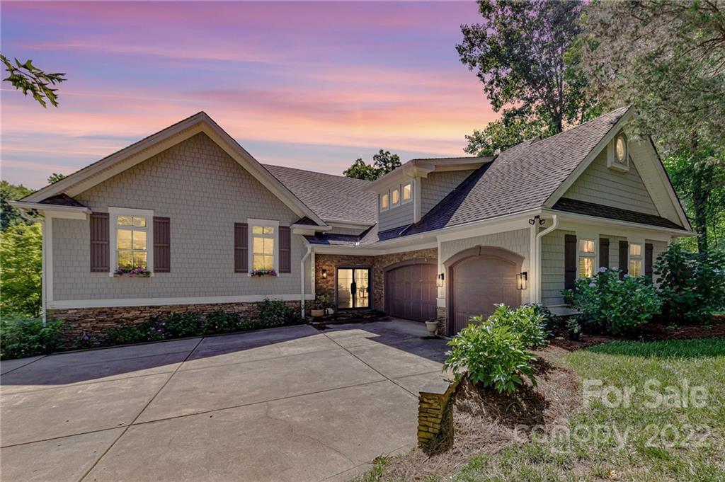 2826 Lake Shore Road South Denver, NC 28037 - Photo 2 of 48 a front view of a house with a garden