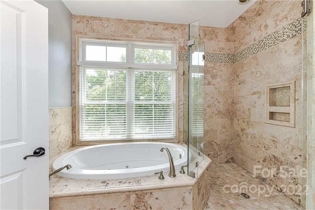 2826 Lake Shore Road South Denver, NC 28037 - Photo 22 of 48 a bath tub sitting in a bathroom next to a window