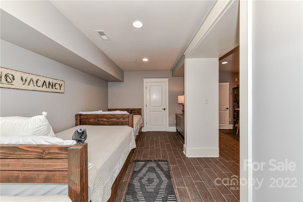 2826 Lake Shore Road South Denver, NC 28037 - Photo 35 of 48 a view of a bedroom with furniture and wooden floor