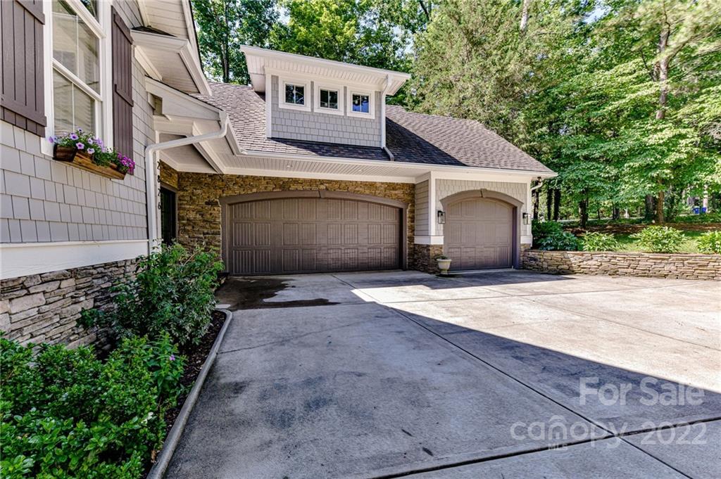 2826 Lake Shore Road South Denver, NC 28037 - Photo 45 of 48 a front view of a house with a yard and garage