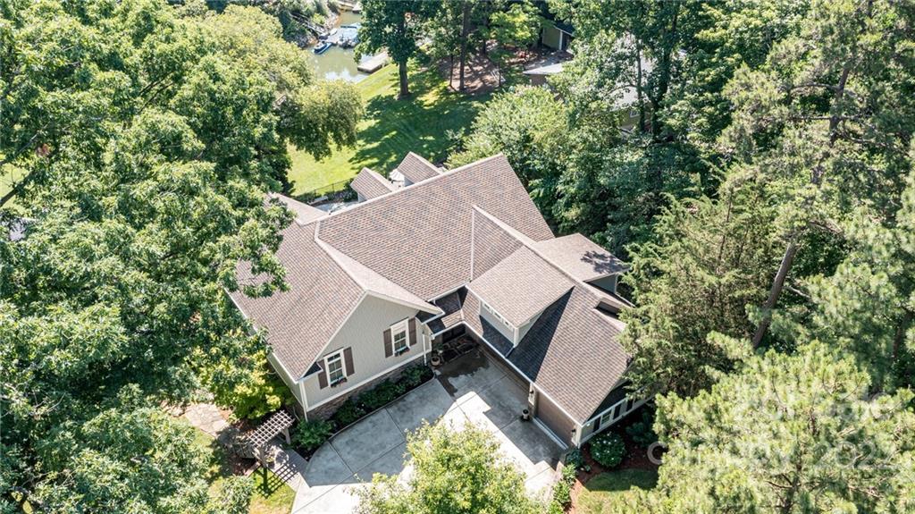 2826 Lake Shore Road South Denver, NC 28037 - Photo 46 of 48 an aerial view of a house with a yard and large trees