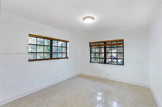 an empty room with windows