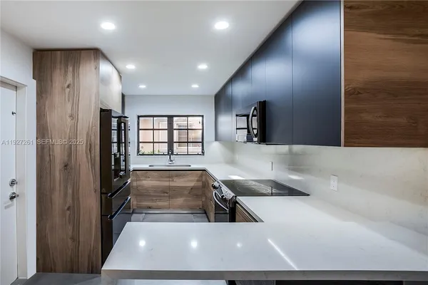 a view of lobby with a large window and chandelier