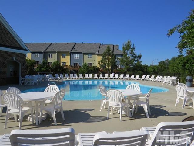 1043 Summerhouse Road Cary, NC 27519 - Photo 24 of 24 a patio with glass top table and chairs