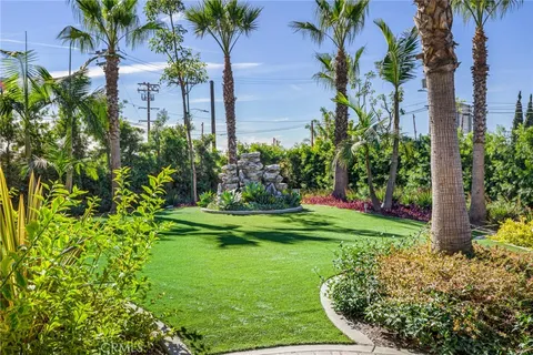 a view of a garden with a fountain