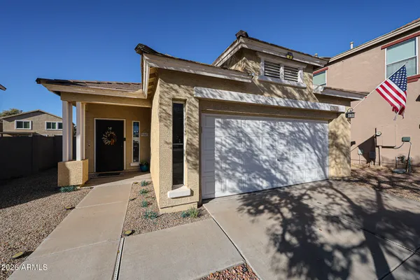 a front view of a house with a garage