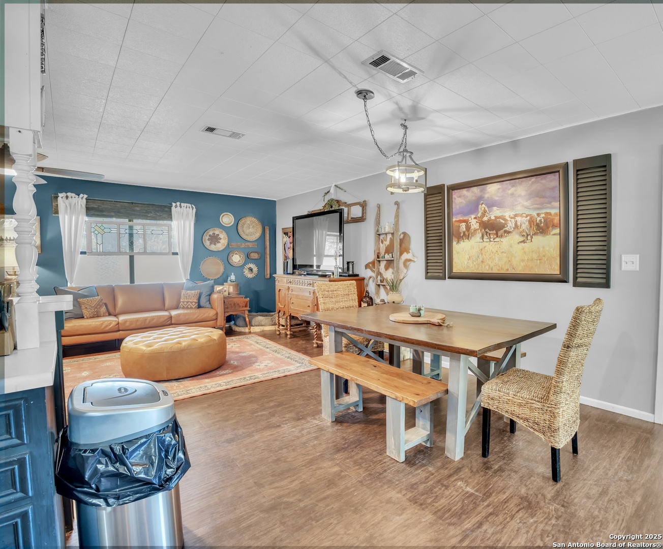 470 Rutledge Road Poteet, TX 78065 - Photo 13 of 40 a living room with furniture a chandelier and a flat screen tv