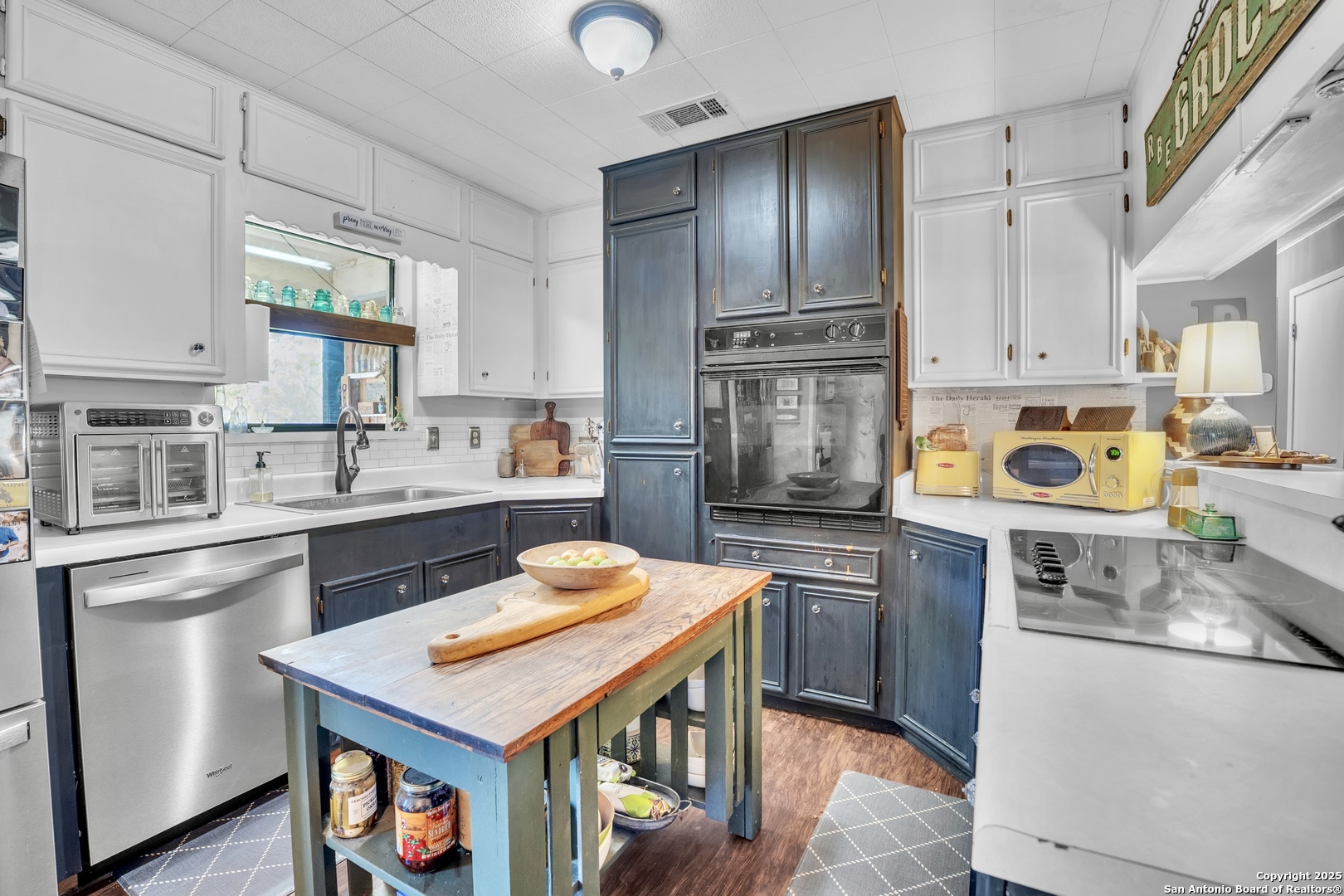 470 Rutledge Road Poteet, TX 78065 - Photo 17 of 40 a kitchen with stainless steel appliances granite countertop a sink stove and refrigerator