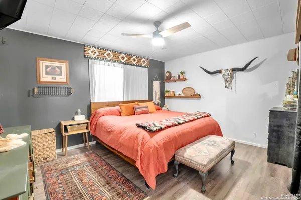 a bedroom with a bed lamp closet and window