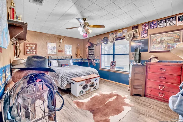 a bedroom with a bed and a dresser