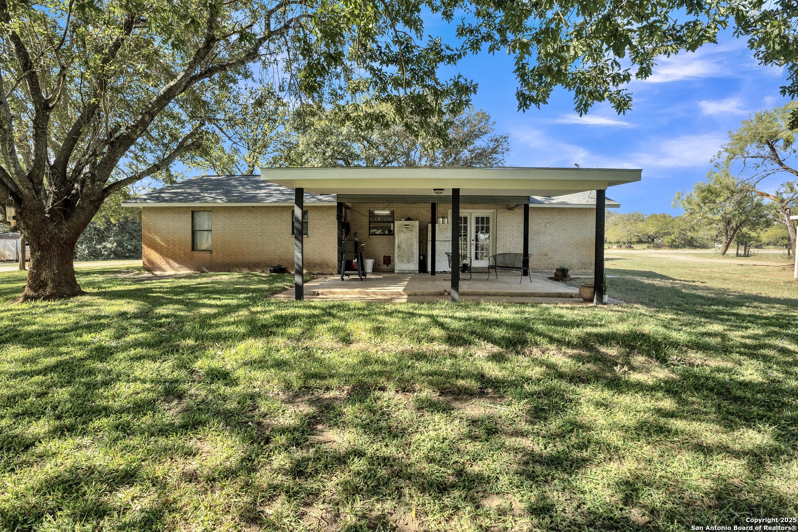 470 Rutledge Road Poteet, TX 78065 - Photo 26 of 40 a front view of a house with a yard