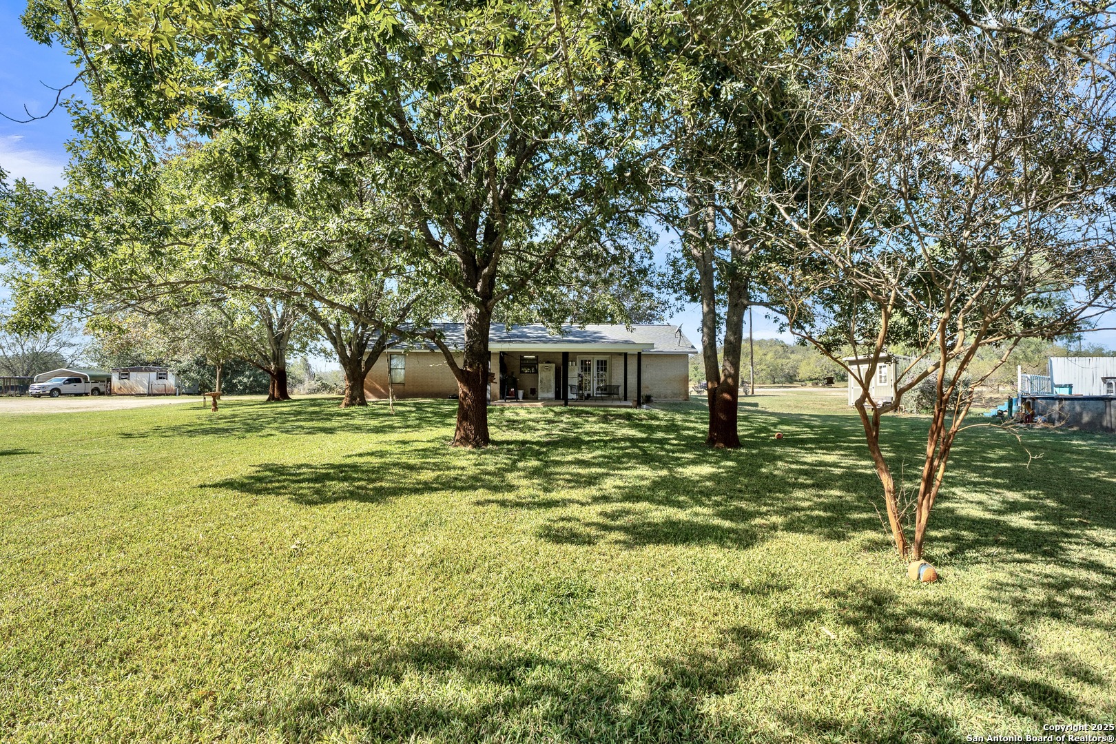 470 Rutledge Road Poteet, TX 78065 - Photo 28 of 40 a view of a house with a yard