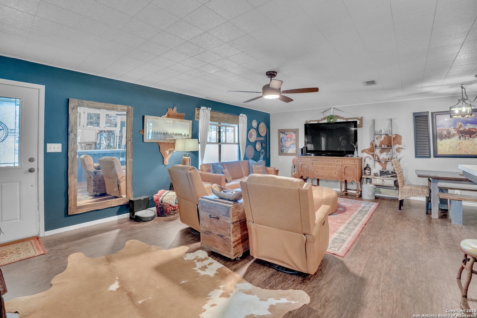 470 Rutledge Road Poteet, TX 78065 - Photo 8 of 40 a living room with furniture flat screen tv and large window