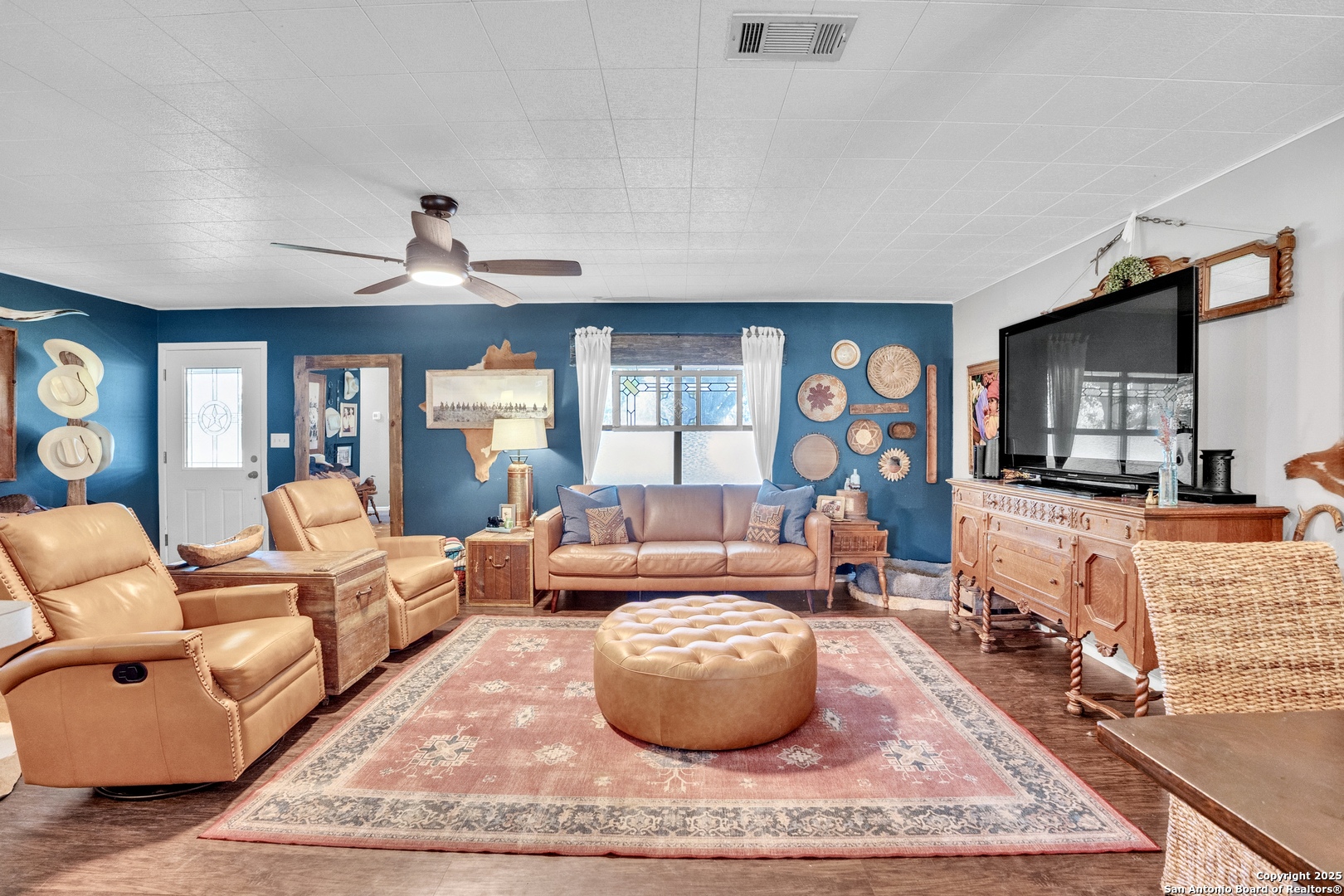 470 Rutledge Road Poteet, TX 78065 - Photo 9 of 40 a living room with furniture a rug and a large window