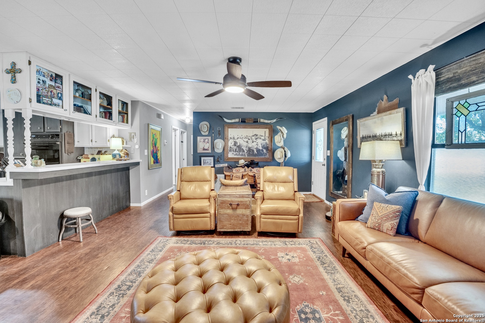 470 Rutledge Road Poteet, TX 78065 - Photo 10 of 40 a living room with furniture and view of kitchen