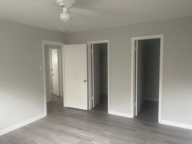 918 Heights Boulevard, Unit 16 Houston, TX 77008 - Photo 4 of 8 an empty room with wooden floor and closet area