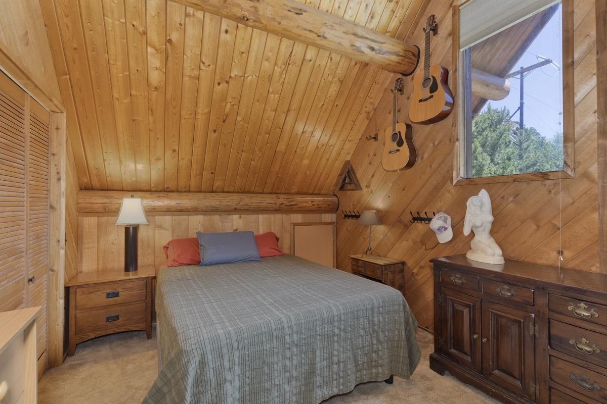 64 Carson Street June Lake, CA 93529 - Photo 16 of 47 a bedroom with a bed and a dresser