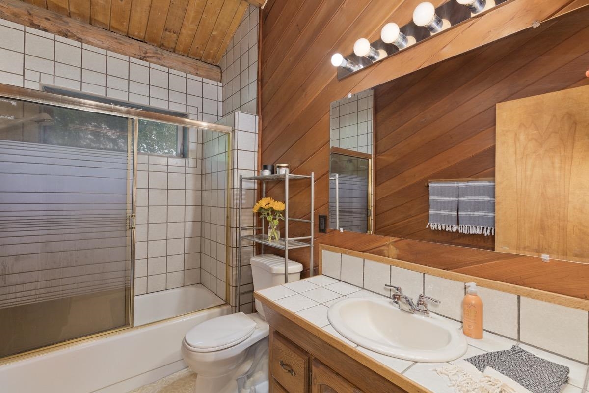 64 Carson Street June Lake, CA 93529 - Photo 18 of 47 a bathroom with a sink a toilet and shower