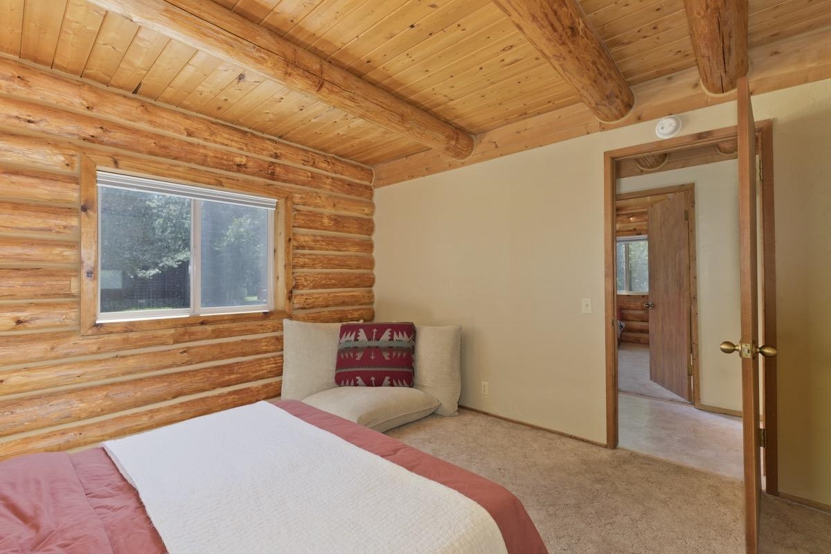 64 Carson Street June Lake, CA 93529 - Photo 20 of 47 a bedroom with a bed and a window