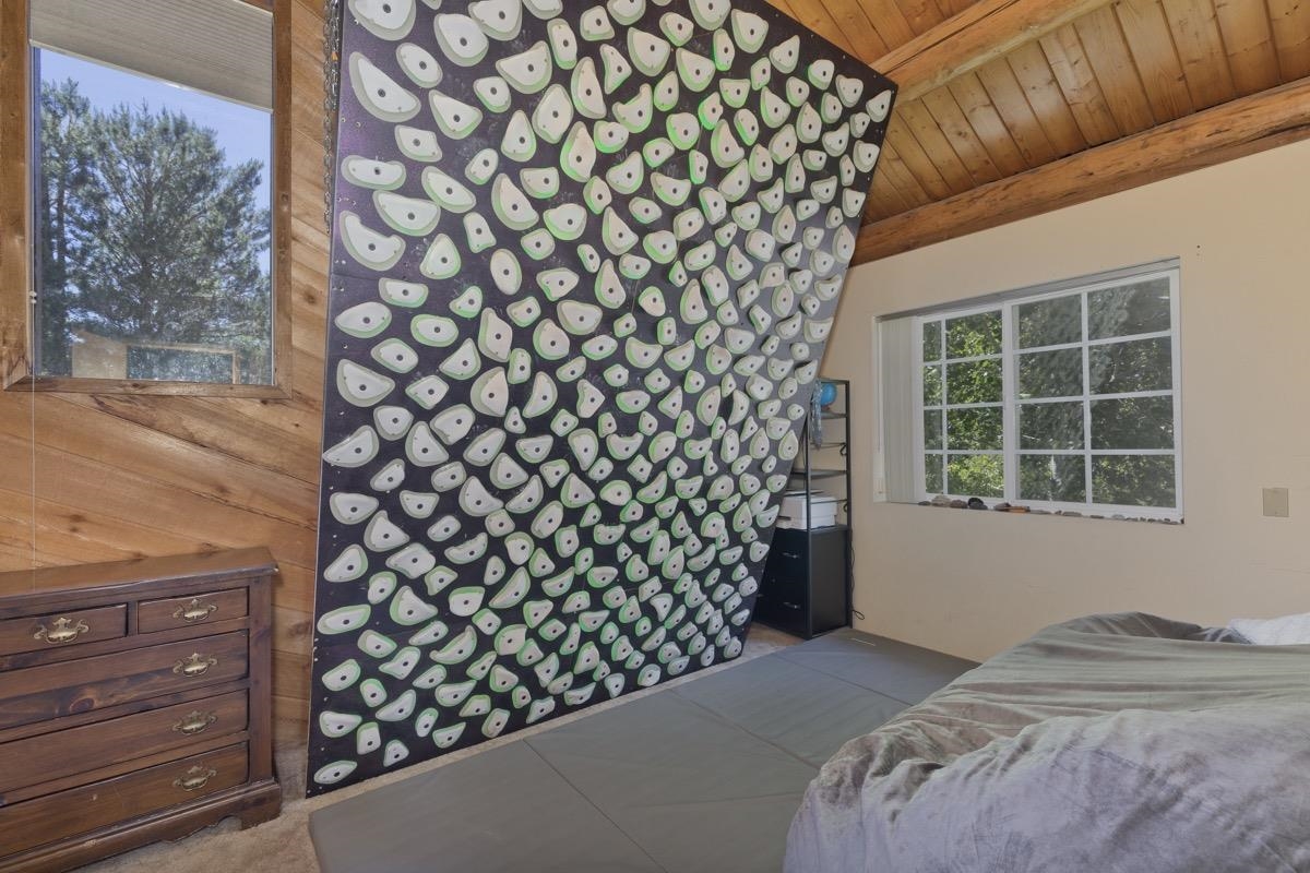 64 Carson Street June Lake, CA 93529 - Photo 28 of 47 a bedroom with a bed and a window