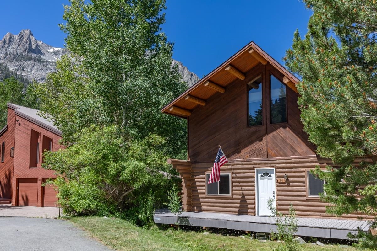 64 Carson Street June Lake, CA 93529 - Photo 30 of 47 a front view of a house with a garden