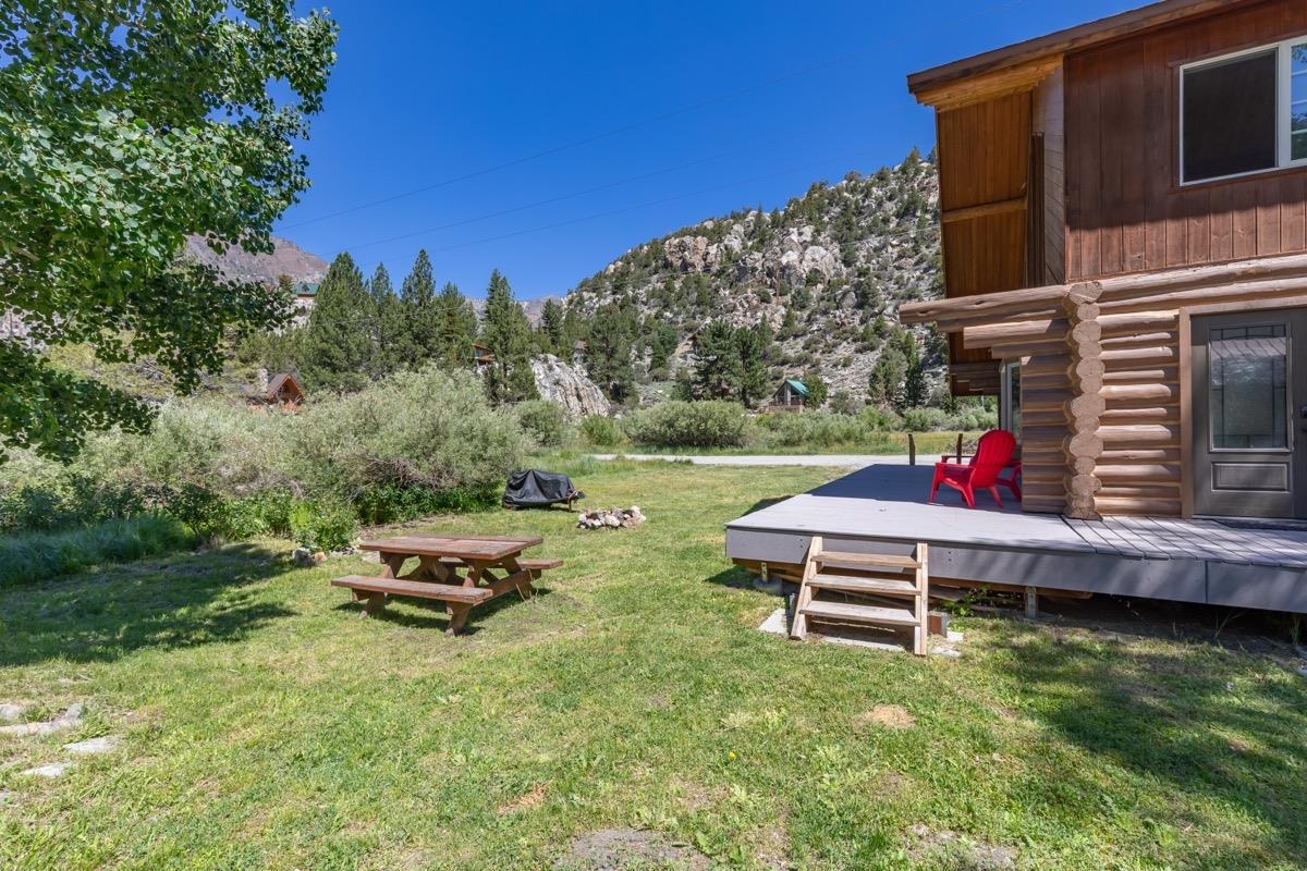 64 Carson Street June Lake, CA 93529 - Photo 36 of 47 a backyard of a house with table and chairs