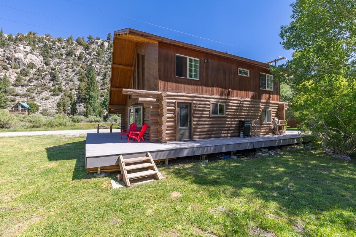 64 Carson Street June Lake, CA 93529 - Photo 37 of 47 a wooden bench sitting in front of a house