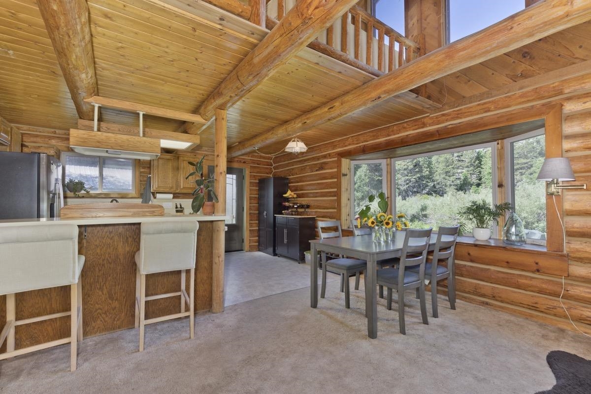 64 Carson Street June Lake, CA 93529 - Photo 4 of 47 a view of a dining room with furniture window and outside view