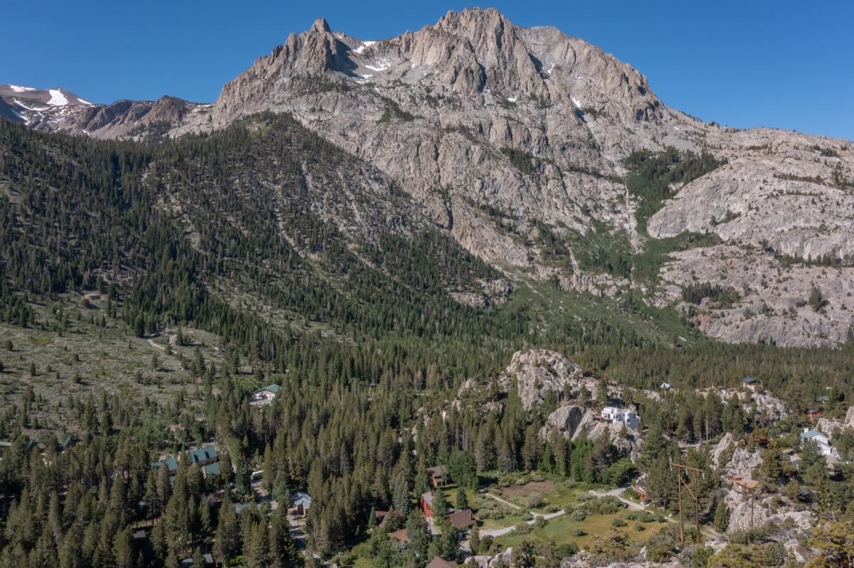 64 Carson Street June Lake, CA 93529 - Photo 44 of 47 a view of a large building with mountains in the background