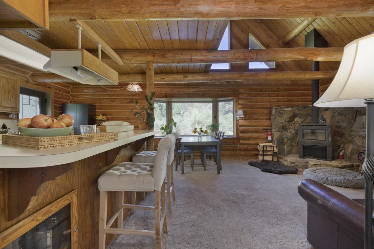 64 Carson Street June Lake, CA 93529 - Photo 6 of 47 a dining room with a wooden table and chairs