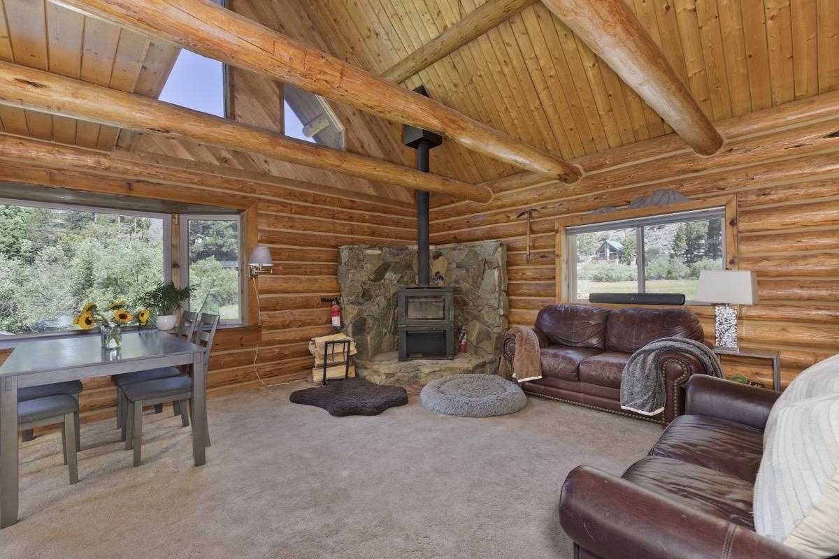 64 Carson Street June Lake, CA 93529 - Photo 7 of 47 a living room with furniture a fireplace and garden view