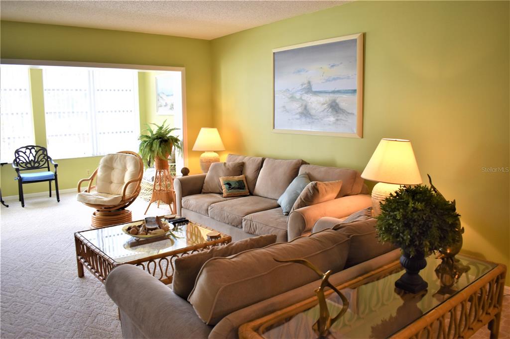 448 Cerromar Road, Unit 189 Venice, FL 34293 - Photo 13 of 48 a living room with furniture and a large window
