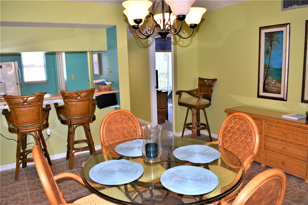 448 Cerromar Road, Unit 189 Venice, FL 34293 - Photo 17 of 48 a dining room with furniture and wooden floor
