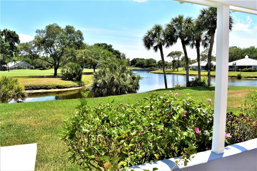 448 Cerromar Road, Unit 189 Venice, FL 34293 - Photo 25 of 48 a view of a garden with a bench