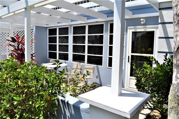 a view of a house with a table and chair