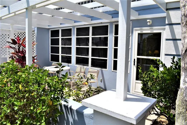 a view of a house with a table and chair