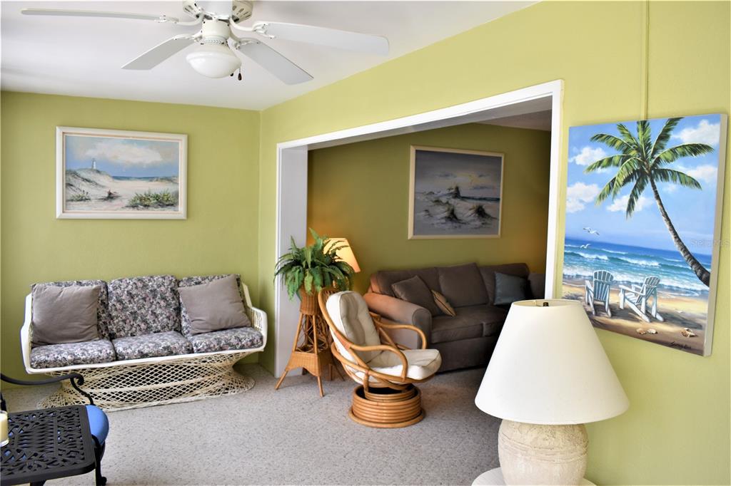 448 Cerromar Road, Unit 189 Venice, FL 34293 - Photo 27 of 48 a living room with furniture and a large window