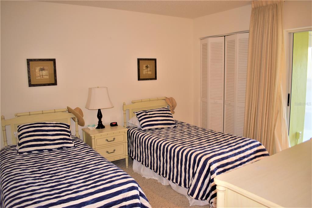 448 Cerromar Road, Unit 189 Venice, FL 34293 - Photo 29 of 48 a bedroom with bed and a window