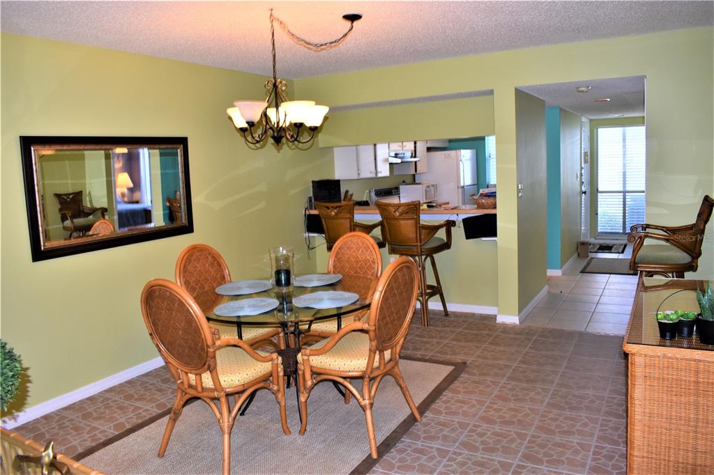448 Cerromar Road, Unit 189 Venice, FL 34293 - Photo 33 of 48 a dining room with furniture and wooden floor
